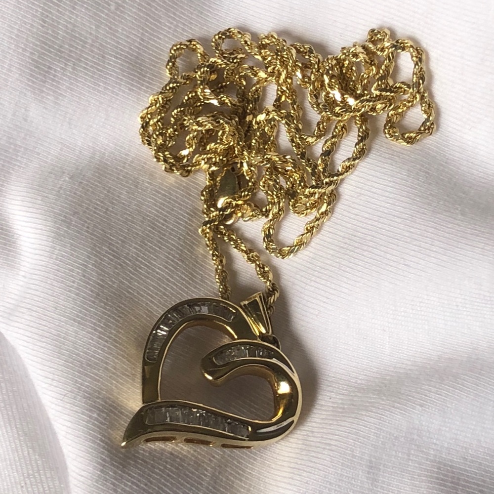 Diamonds gold heart pendent with rob chain $299